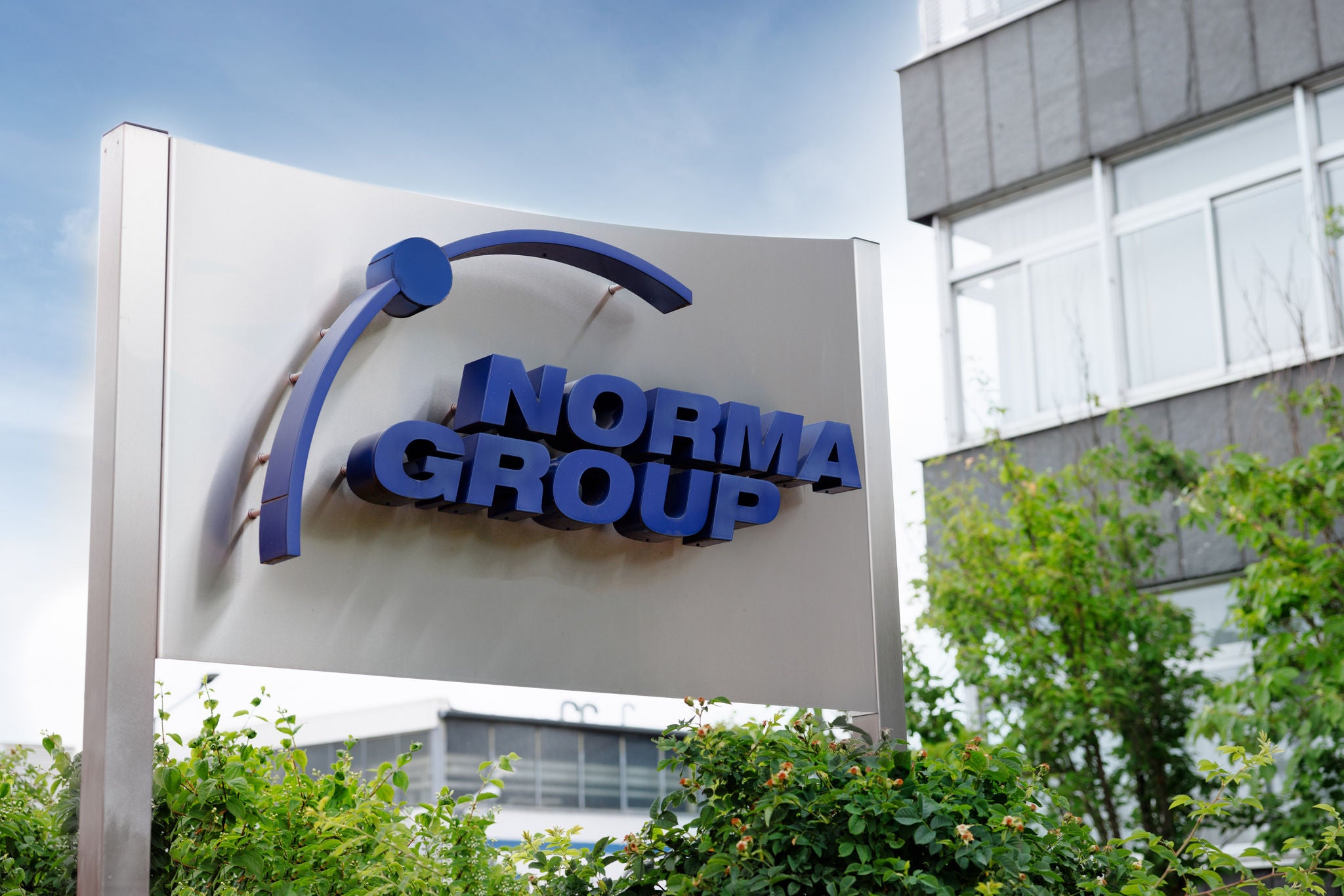 NORMA Group logo at the headquarters in Maintal, Germany