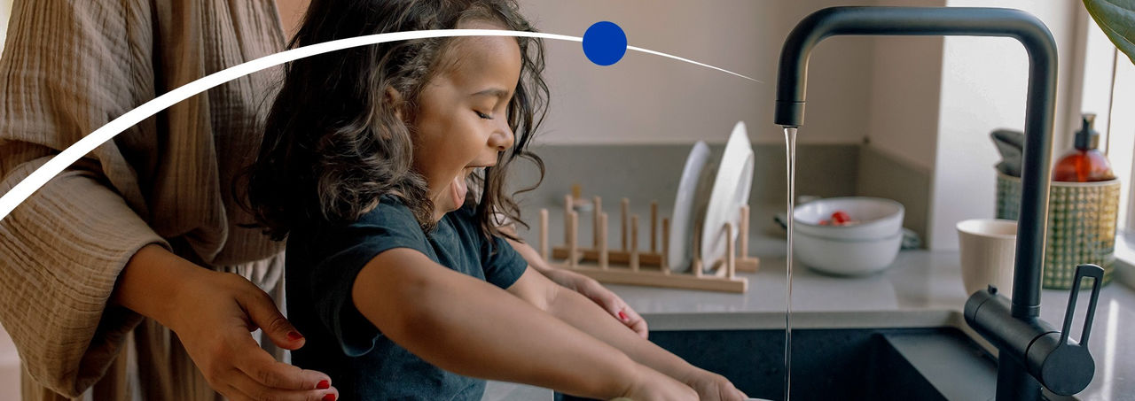 laughing girl doing the dishes